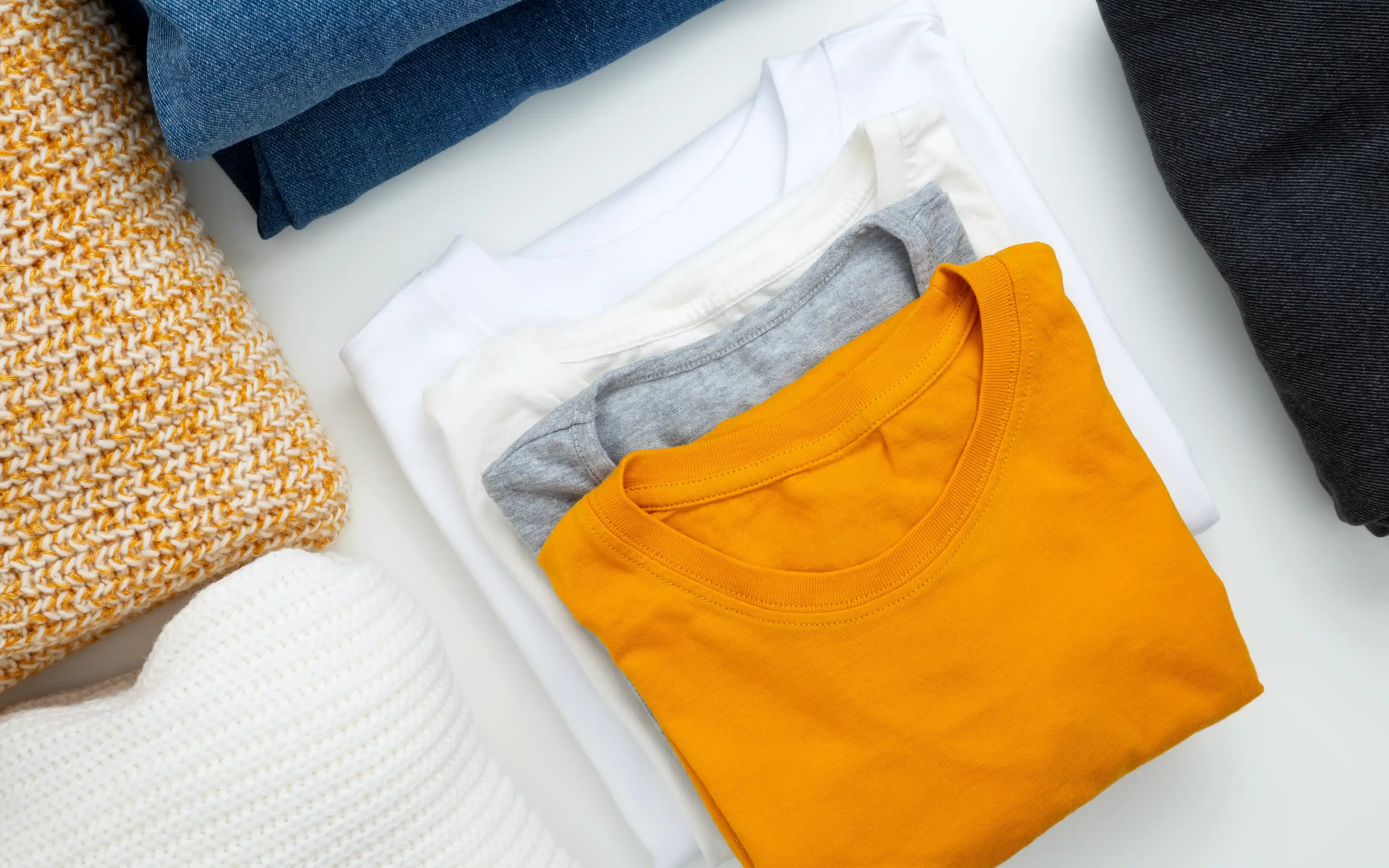 Folded clothing items that have been freshly laundered.