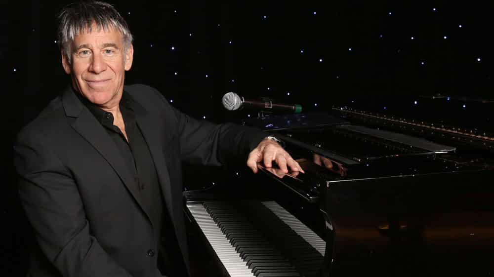 Stephen Schwartz behind his piano on Dawn Princess.