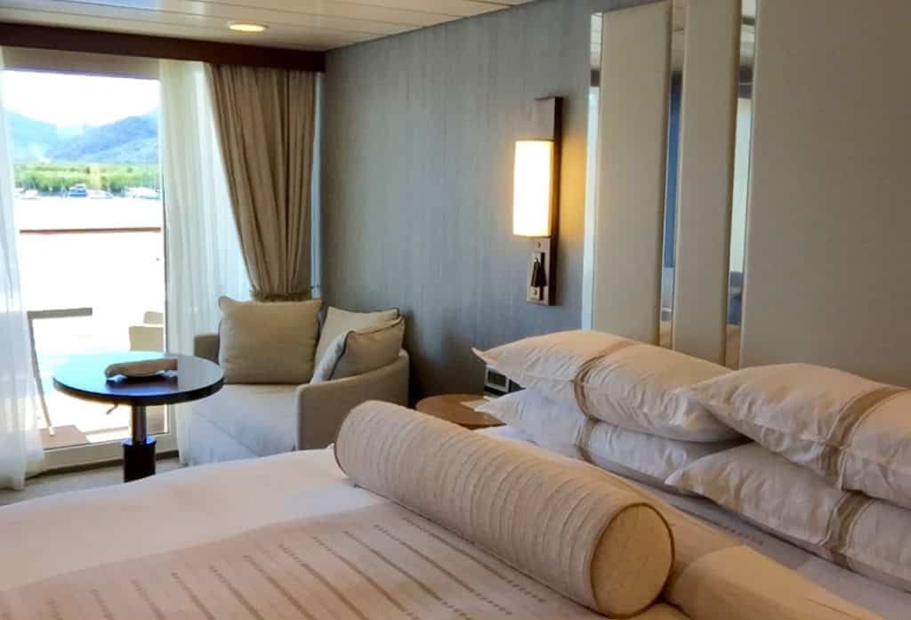 The Azamara Quest Club Veranda Stateroom living space.