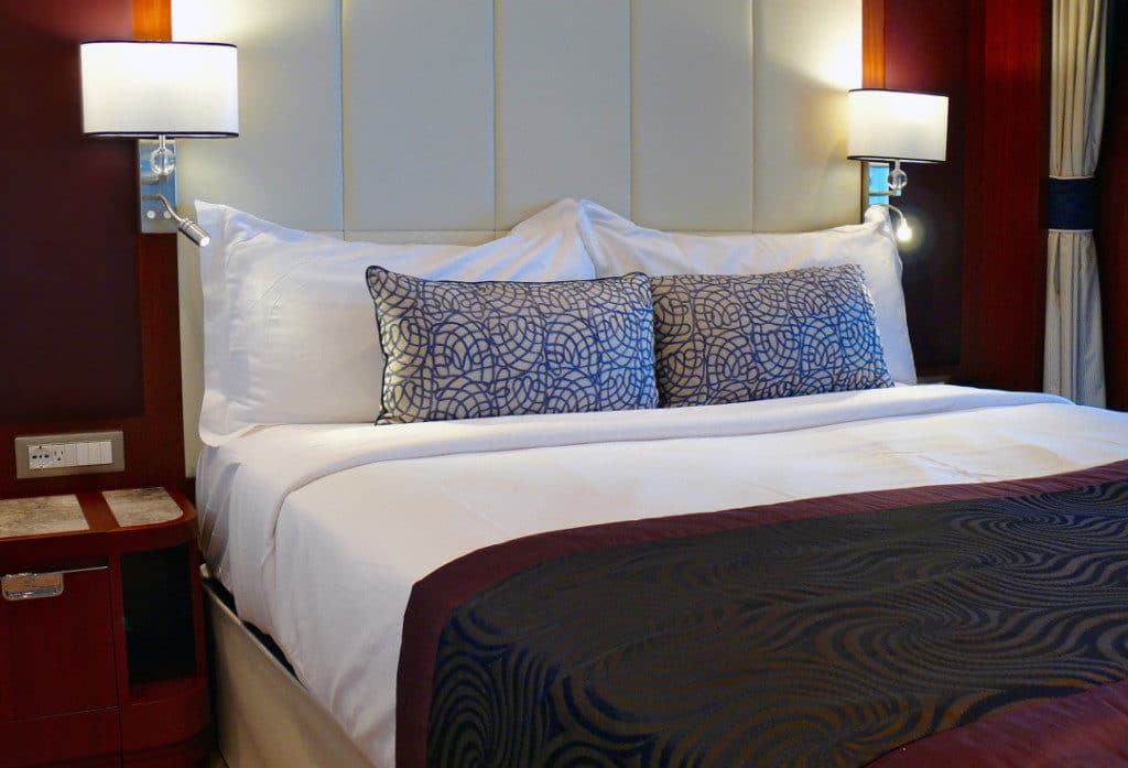The luxurious bed with fine leather bedhead.