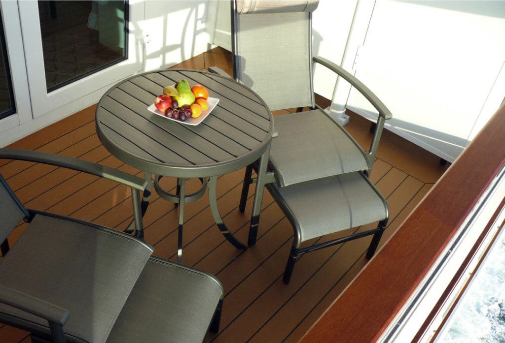 The spacious veranda with reclining deck chairs.