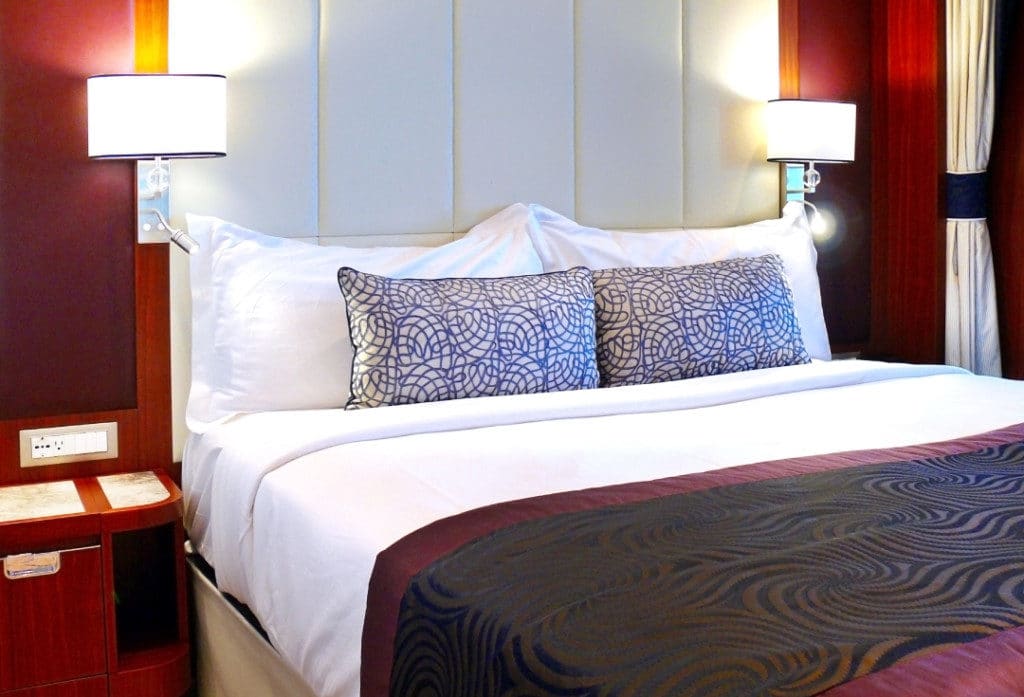 The luxurious bed with fine leather headboard.