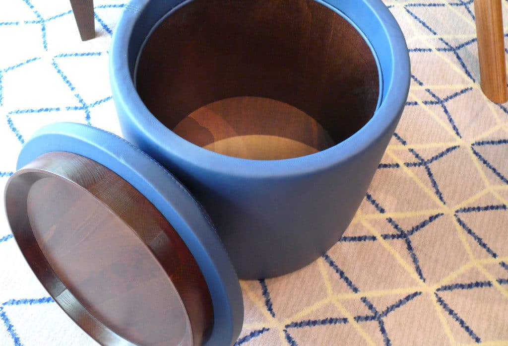 There is storage space inside the ottoman.