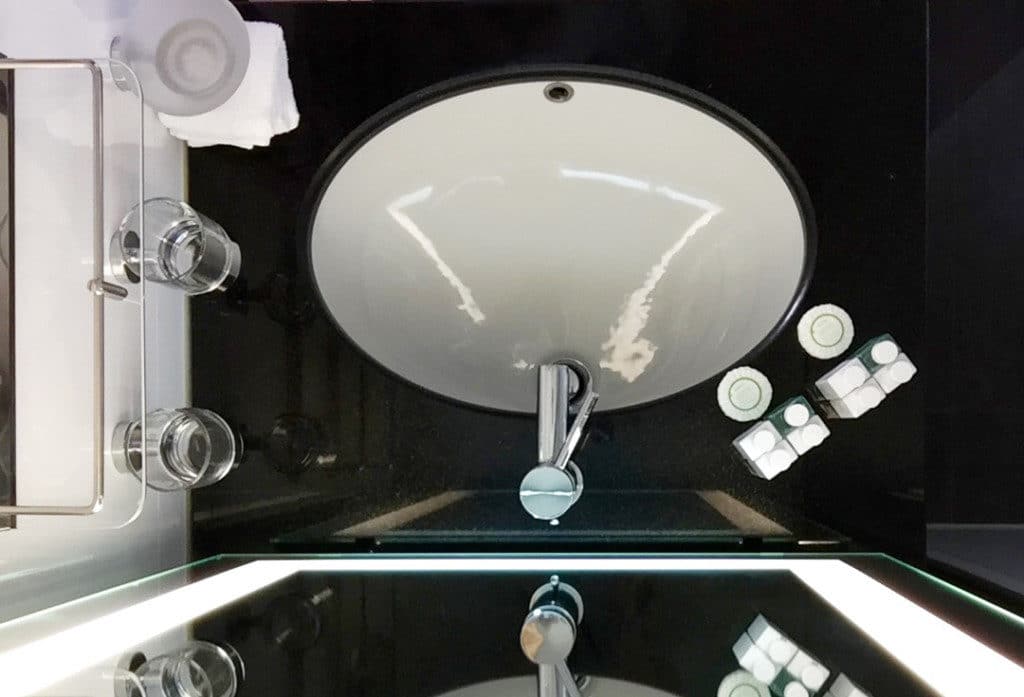 There is ample storage space around the vanity.