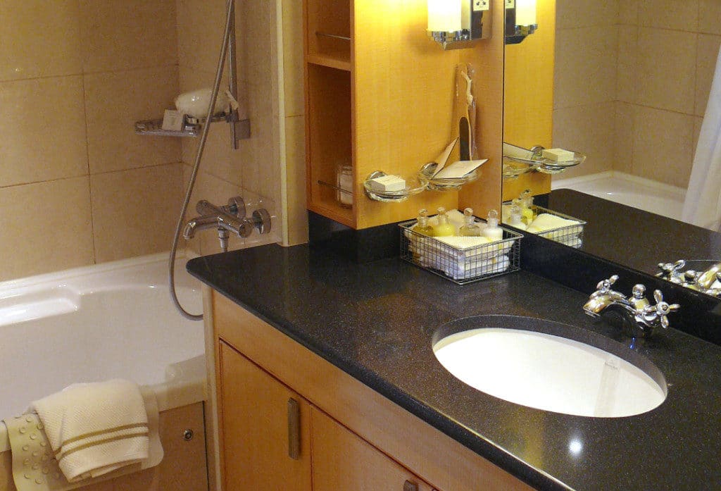A combination Jacuzzi tub and shower are in the Queens Suite bathroom.