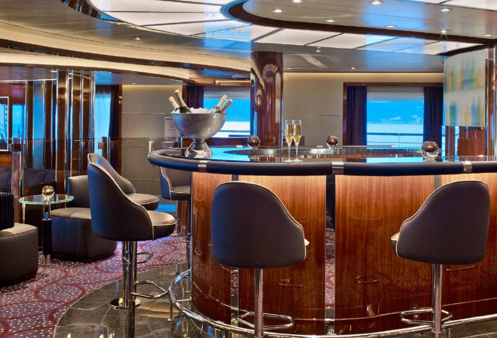 Bottles are painted on the wall behind the Seabourn Encore bar.