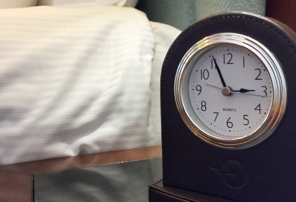 The bedside clock is a handy addition.