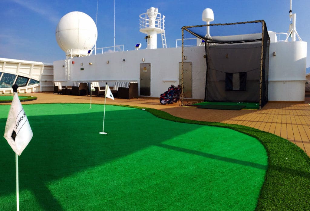 Practice your golf swing in The Retreat on Seabourn Odyssey.