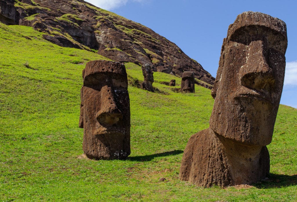 Visit Easter Island in the Pacific to see the iconic stone statues.