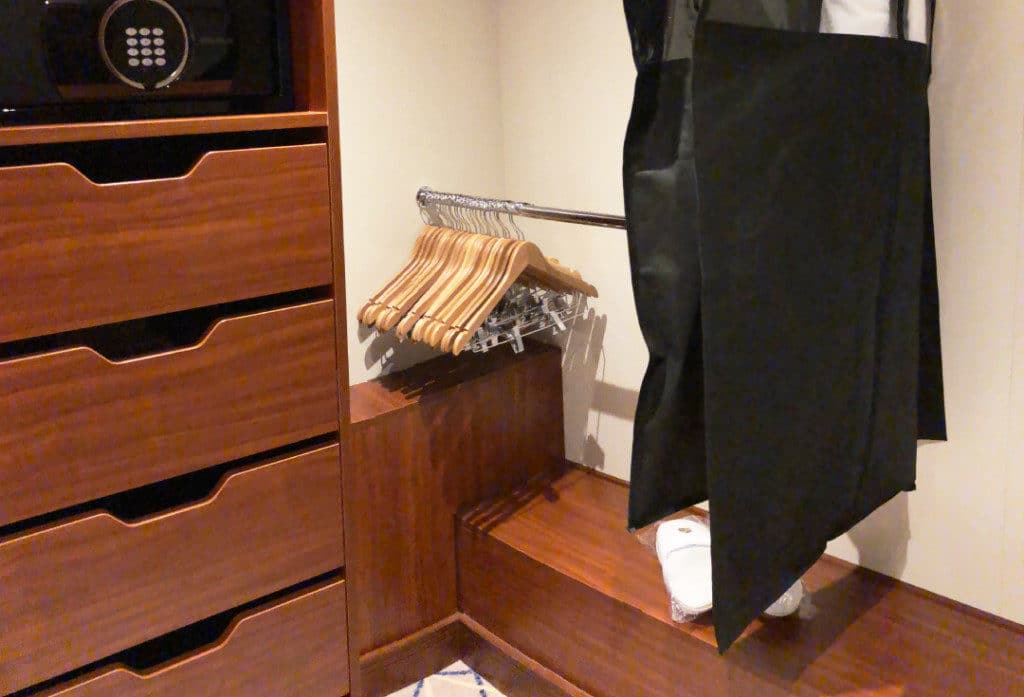 The closet has room for two cases full of clothing.