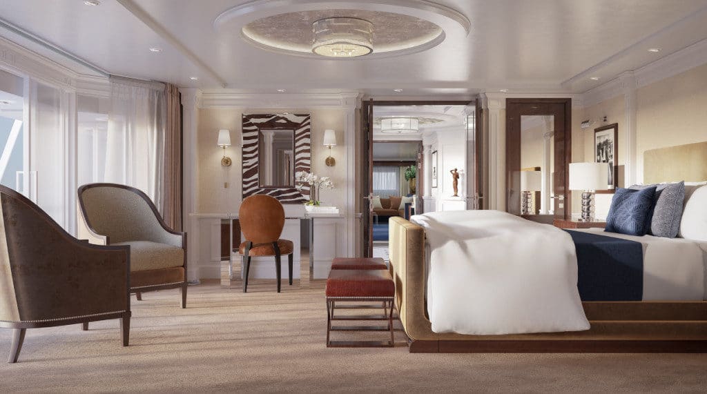 The new Oceania Owners Suite bedroom boasts a king-size bed and elegant Mayfair Bergere side chairs.