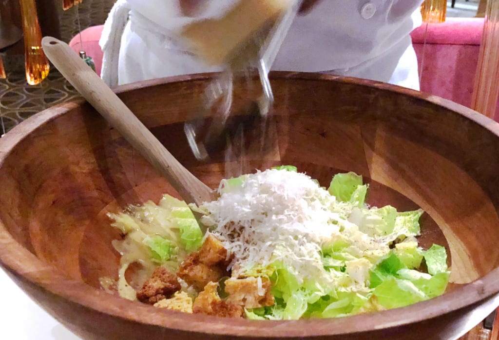 Thomas Keller's Caesar Salad is prepared table side.
