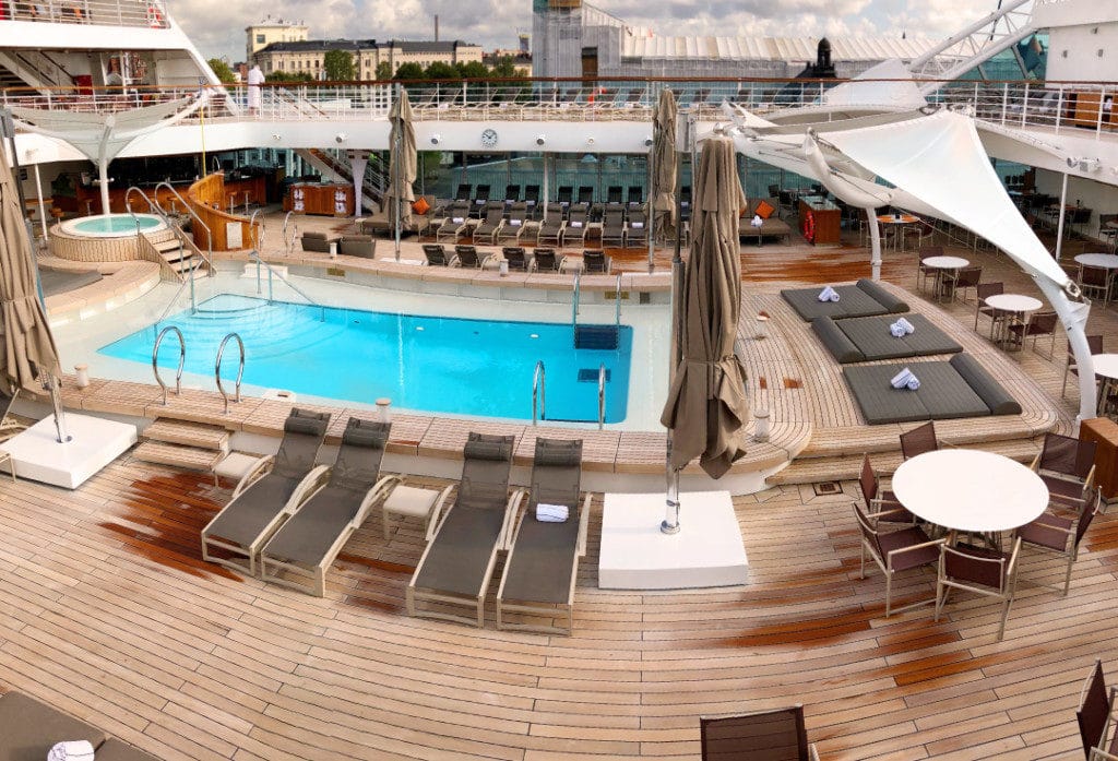 The largest of the Seabourn Ovation pools - with teak decking and sun loungers.