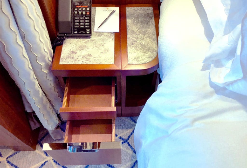 Clever split-level drawers and bedside book compartment.