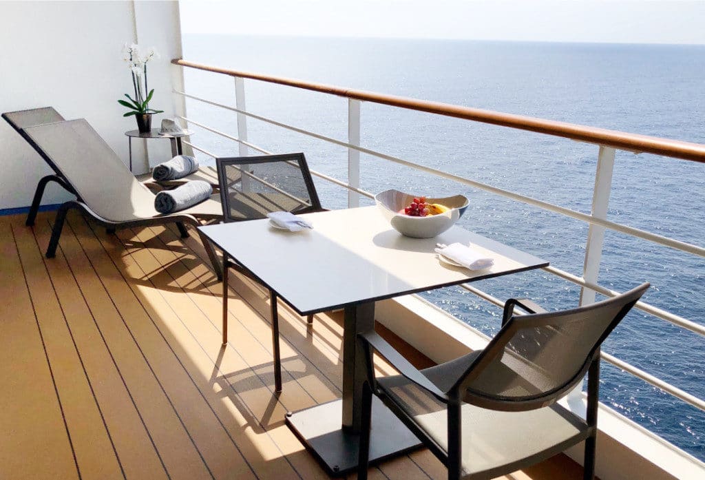 The Silver Suite veranda includes sun loungers and a dining table.