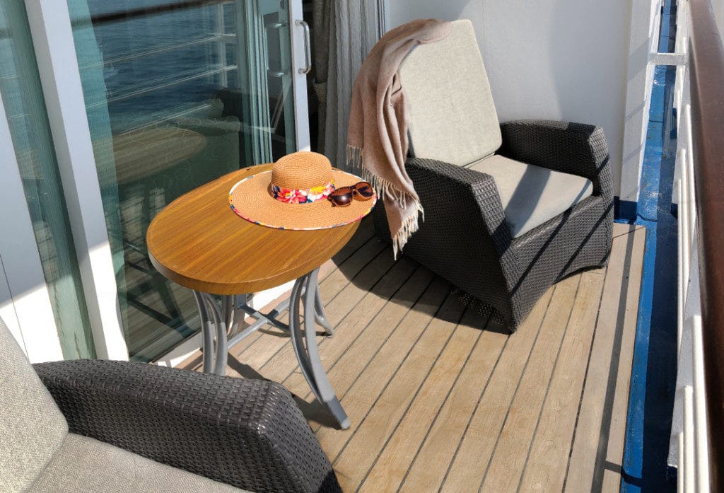 The Penthouse Suite veranda has luxe recliners and a cocktail table.