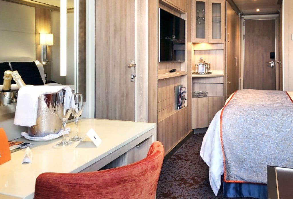 The Verandah Stateroom has a writing desk and wall mounted TV.