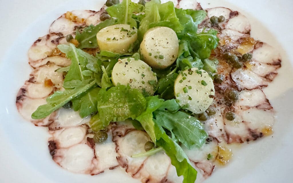 Octopus Carpaccio with Champagne Vinaigrette & Warm Potato Salad.