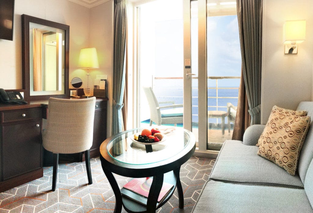 The comfortable sitting area in the Oceania Riviera Veranda Stateroom.