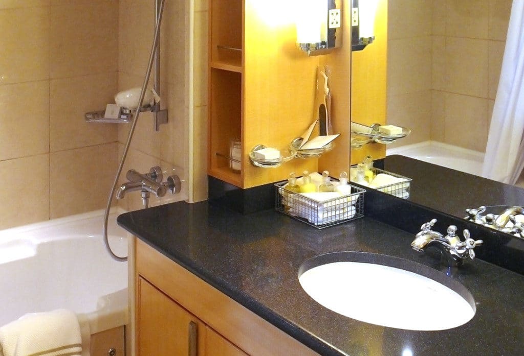 A combination Jacuzzi tub and shower are in the Queens Suite bathroom.