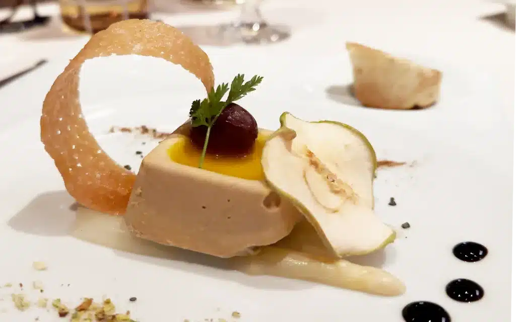 Rougie Goose Liver with White Port Marinade, Essence of "Granny Smith Apples", Asparagus Slivers, Red Grapes, Lemon, Verbena Leaves, Extra Virgin Olive Oil, and Duck Jus Emulsion.