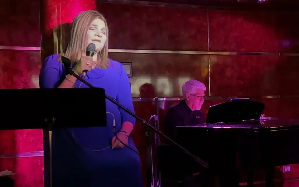 A female jazz singer and a male pianist.