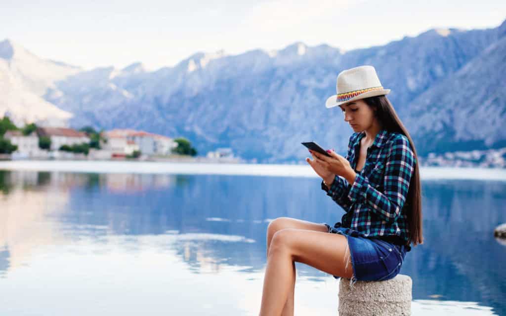 A woman sends message using a Seabourn internet package.