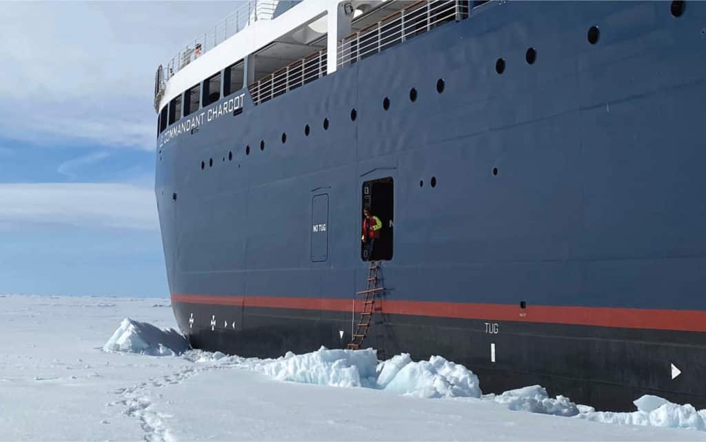 A rope ladder descends from Le Commandant Charcot to the ice at the North Pole.