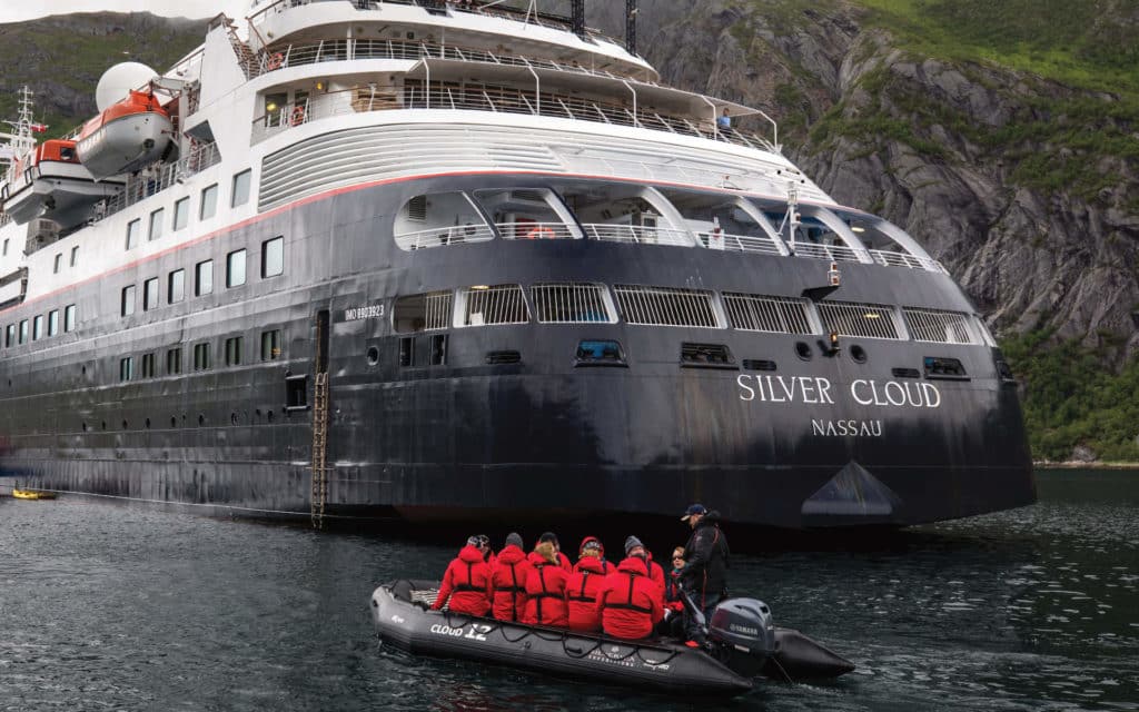 Silversea guest return to Silver Cloud after a day of Zodiac explorations.