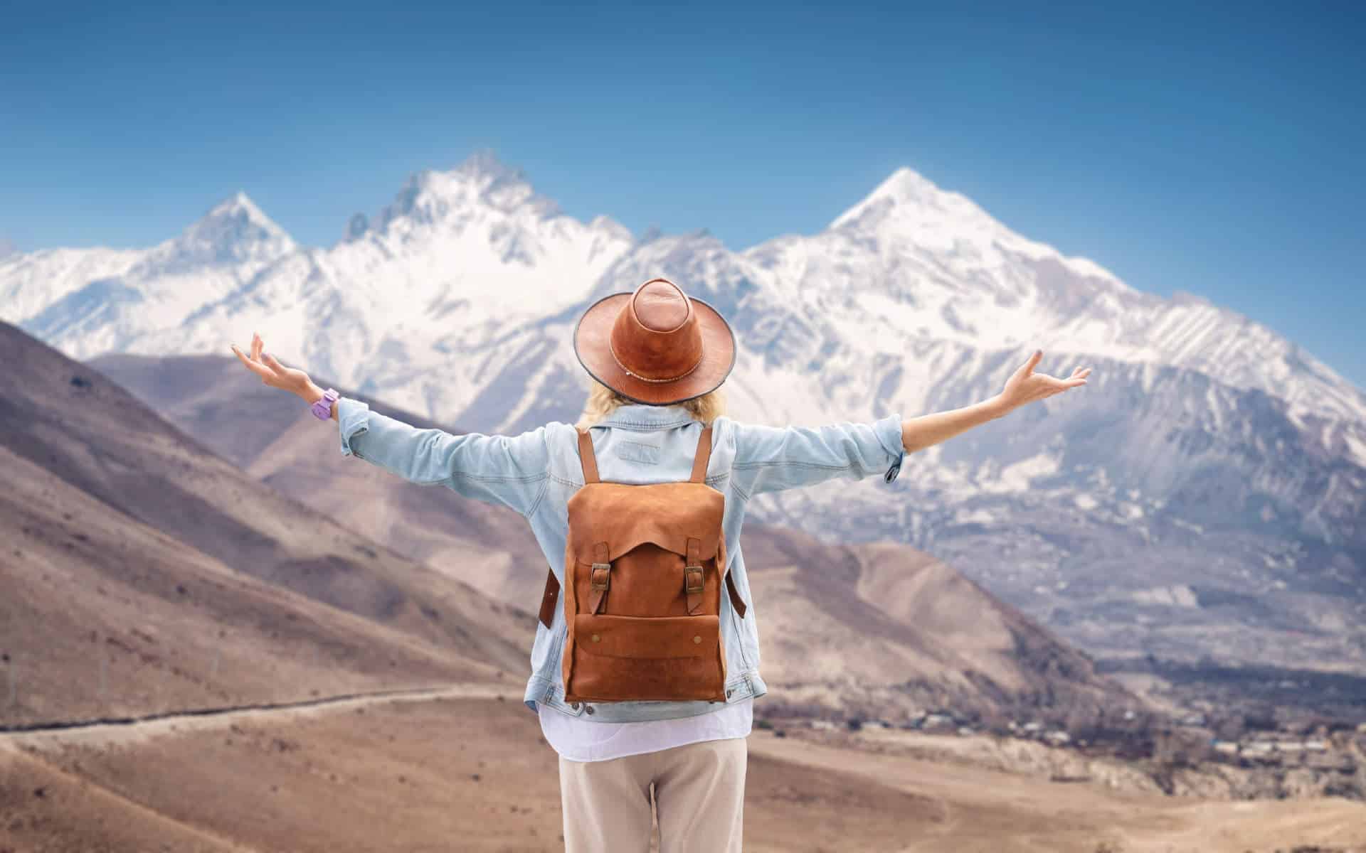 Atlas travel insurance will offer guests piece of mind when hiking, like the woman in this picture.