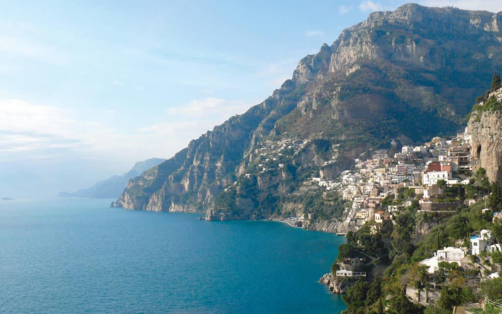 Towns cling to the dramatic cliffs of the Amalfi Coast, Italy.