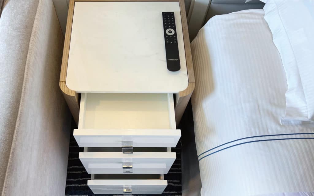 A nightstand in an Oceania Nautica Veranda Stateroom.