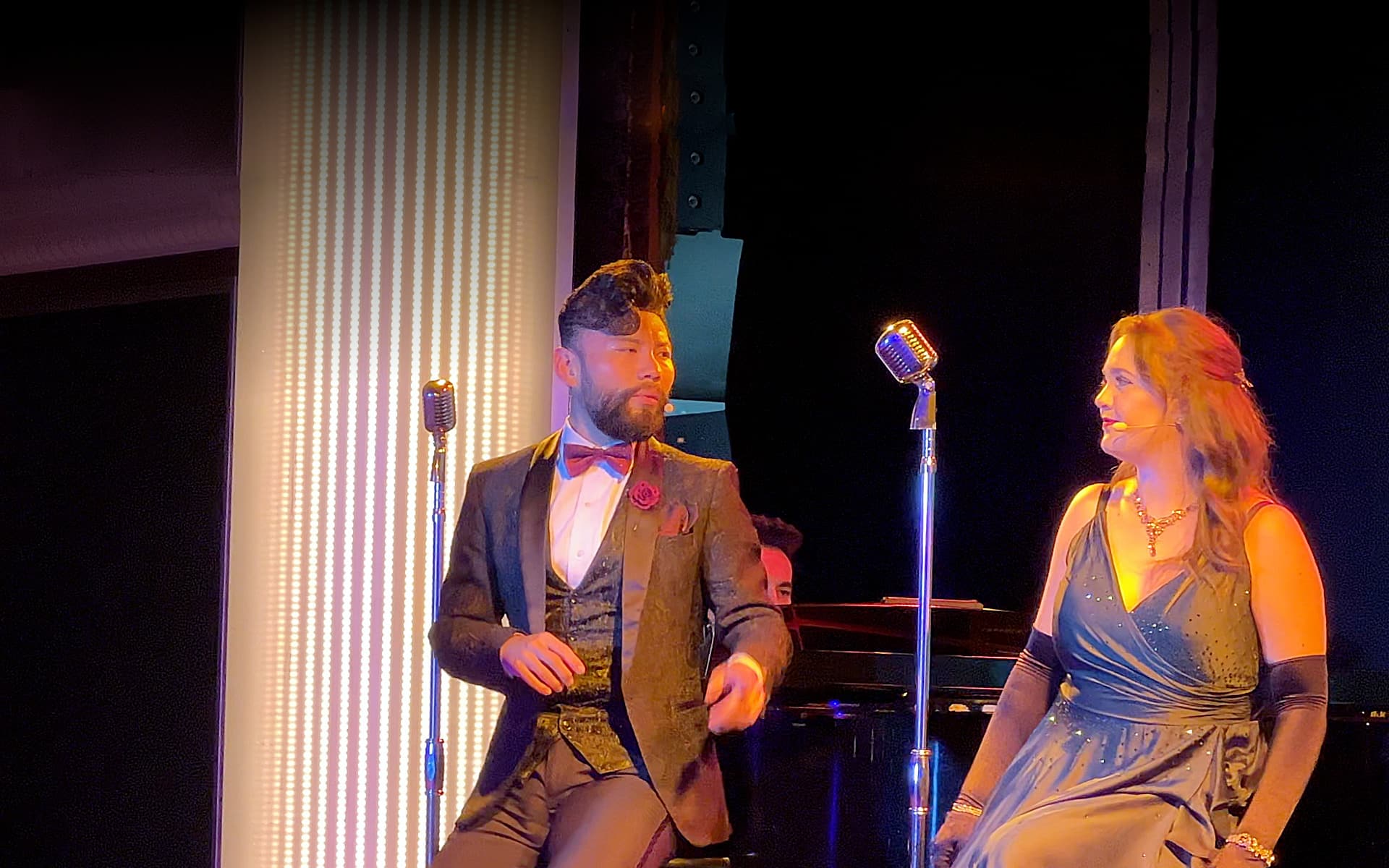 Cast members sing on the Azamara Quest stage.