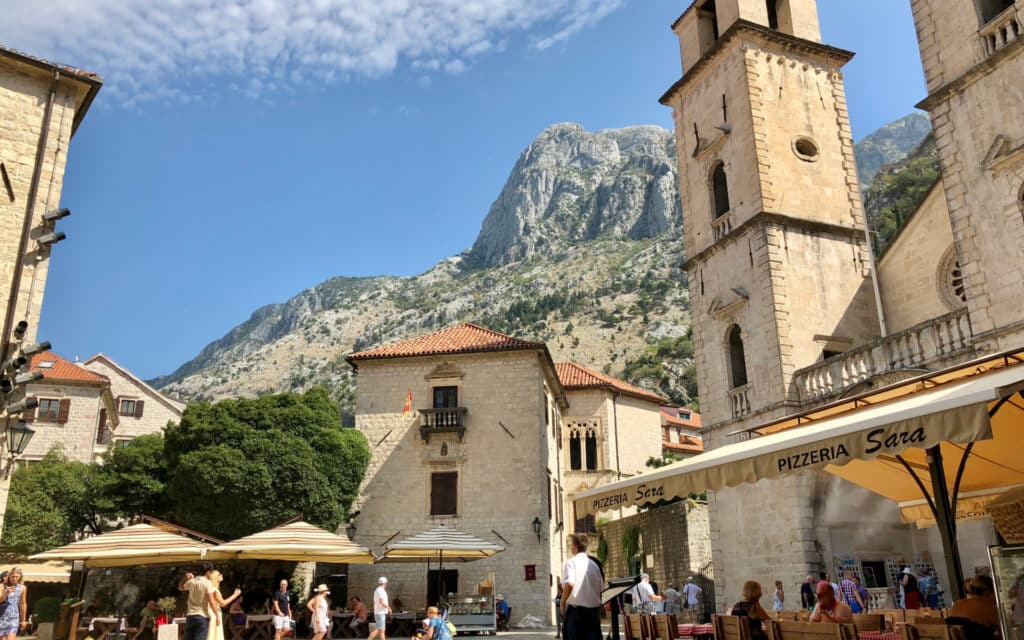 Restaurants line the charming main square in Kotor, Montenegro.