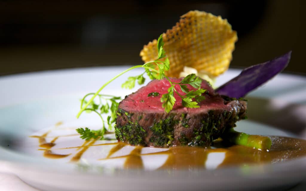 A steck served in the Dining Salon on Sea Dream Yacht Club.