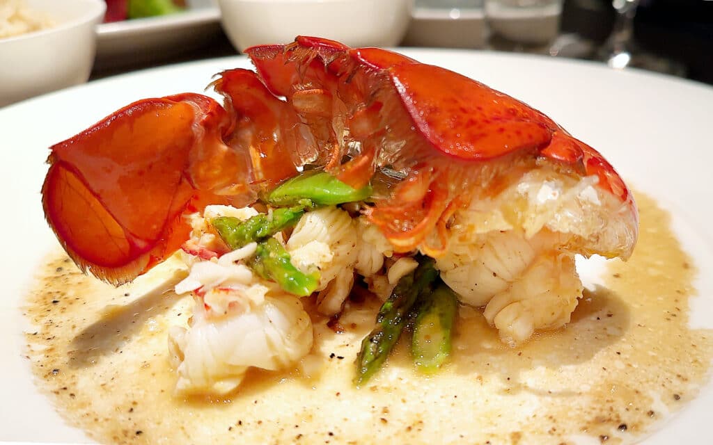 Stir Fried Lobster with Garlic, Asparagus and Shitake Mushrooms, Finished with Truffle Uzu.