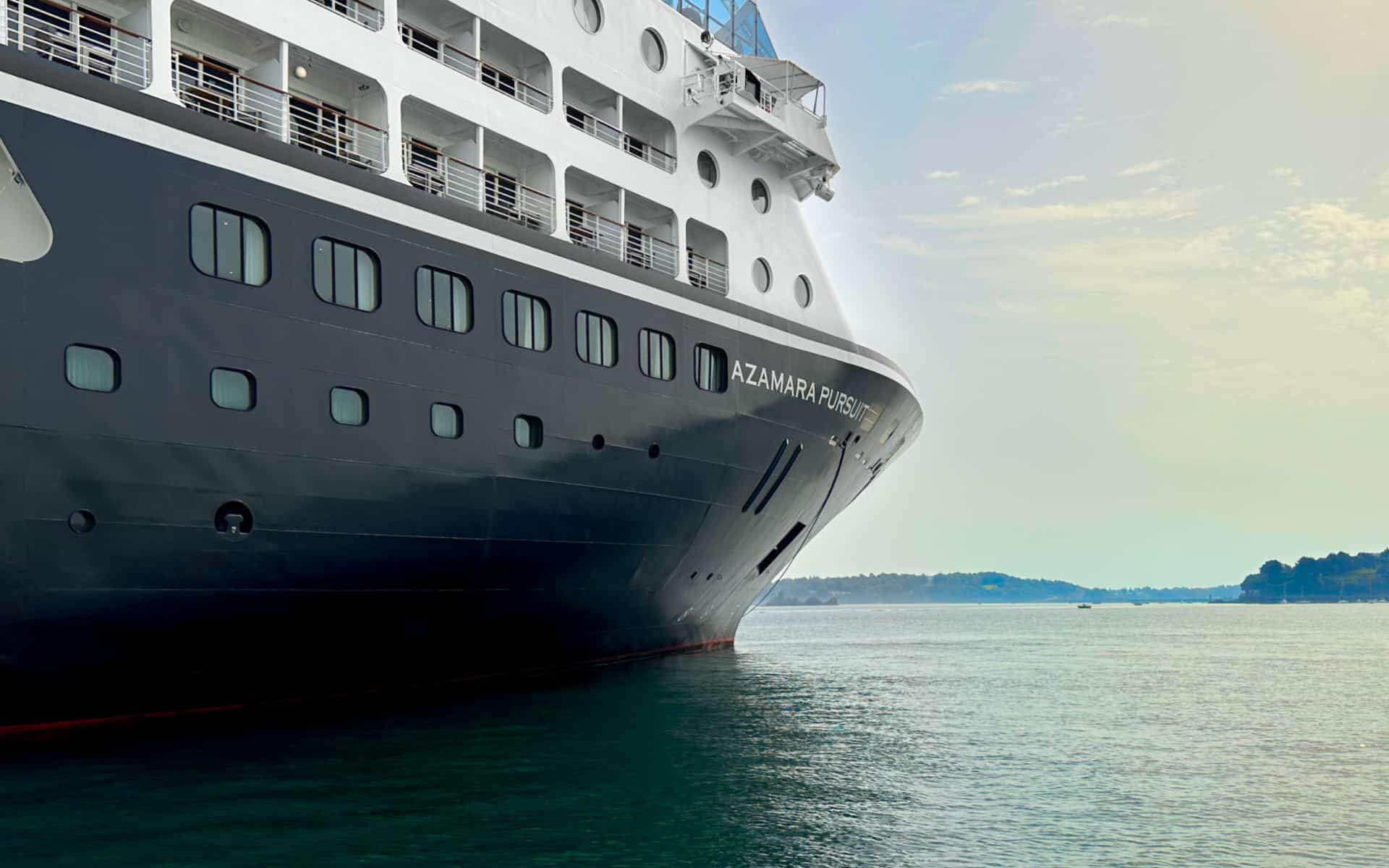 A view of the Azamara Pursuit cruise ship at anchor.