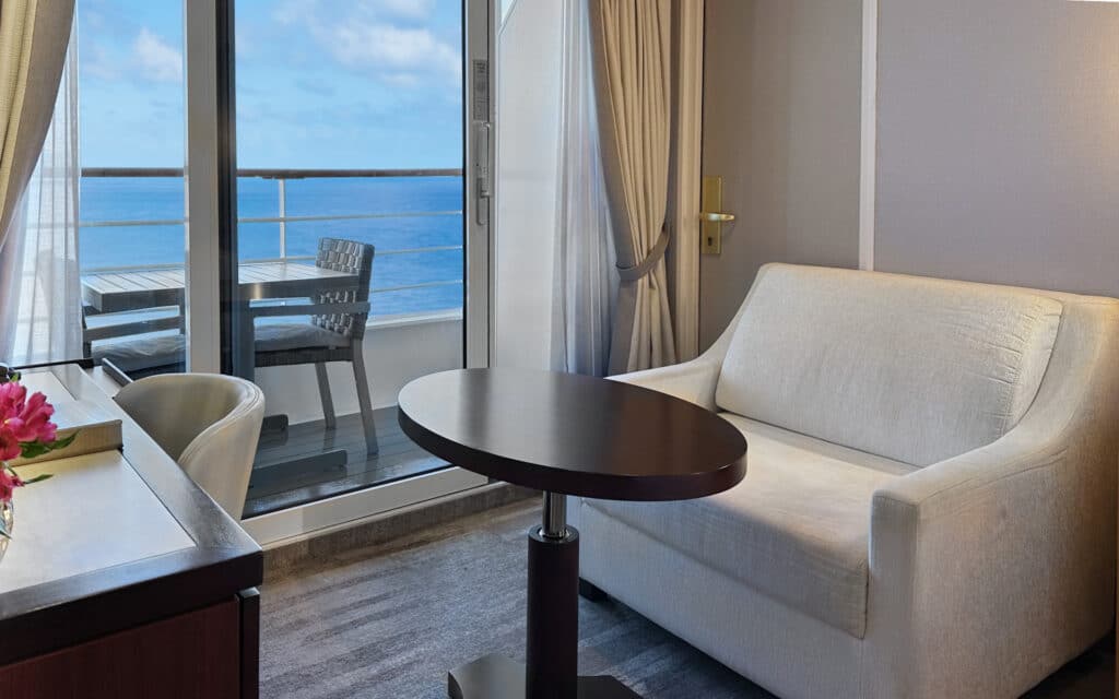 The sitting area in an Azamara Pursuit Veranda Stateroom.