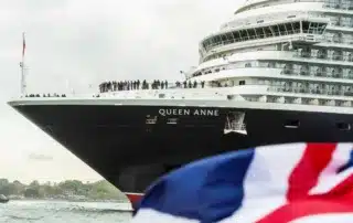 Passengers on the bow of the Queen Anne cruise ship.