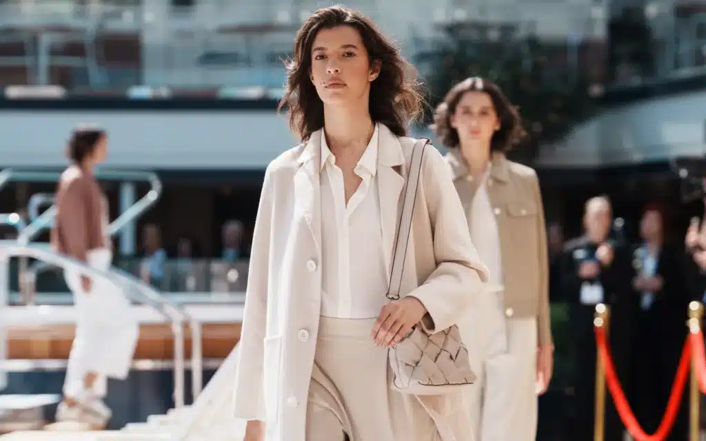Female models on a poolside catwalk aboard Queen Mary 2.