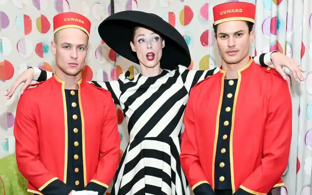 Coco Rocha with Cunard Bellhops.