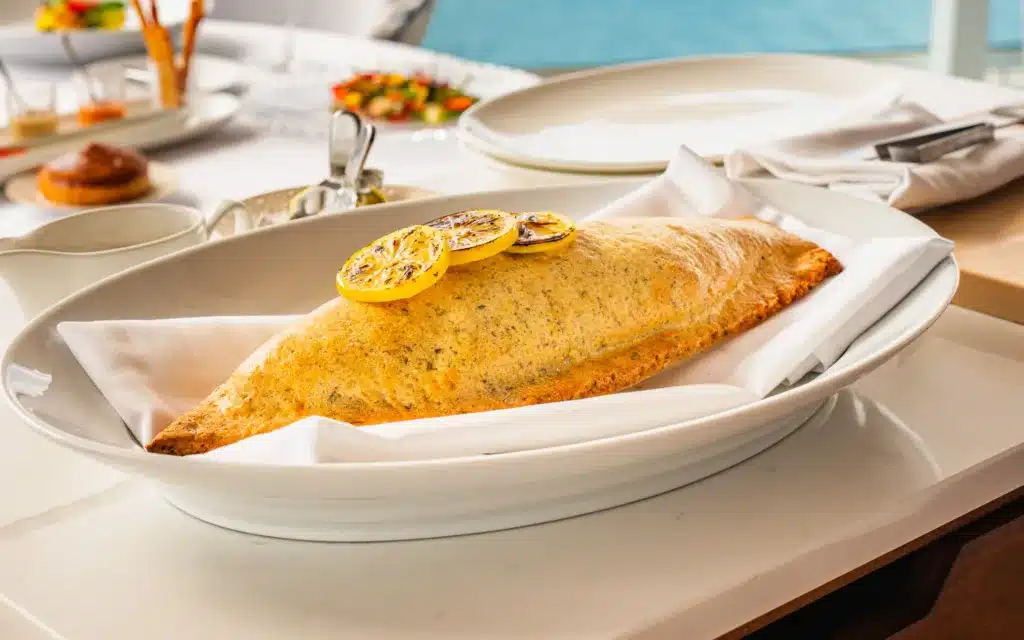 A plated Branzino fish.