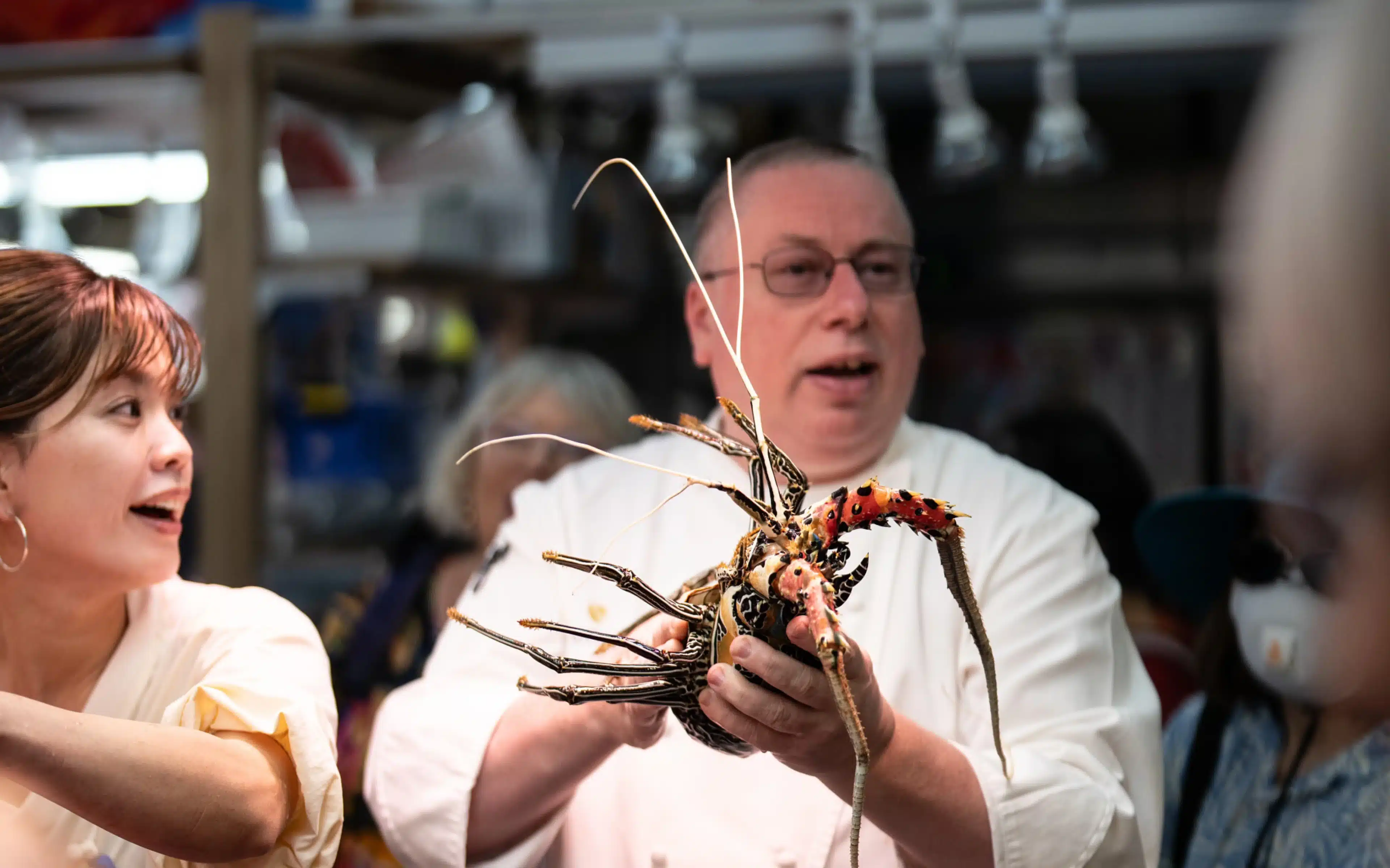 A chef and tourist in the Nagasaki fish market, Japan.