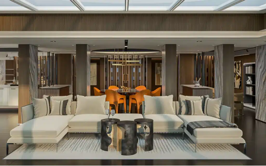 A sofa in the foreground, and dining setting behind.