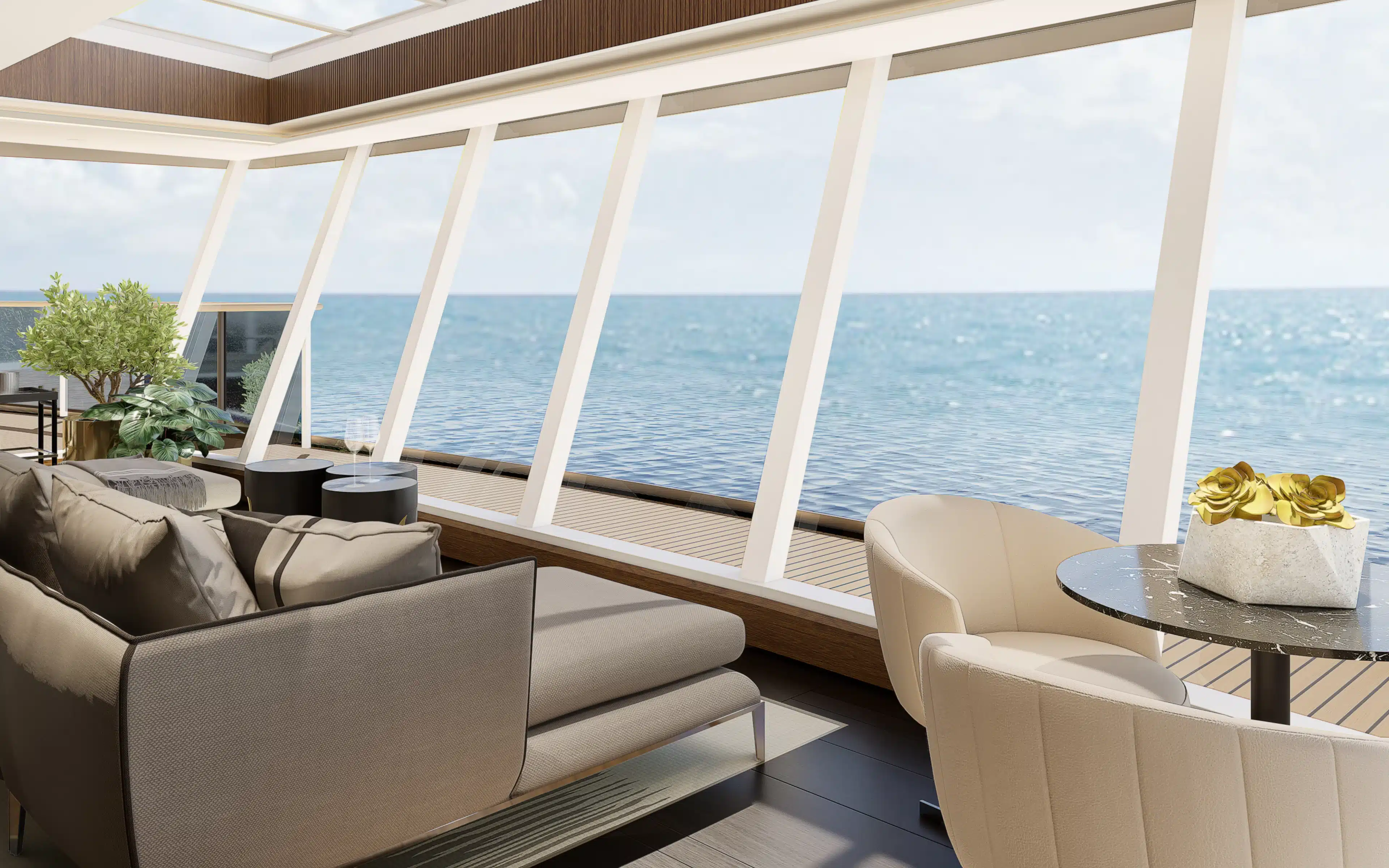 A sofa facing windows looking out to sea.