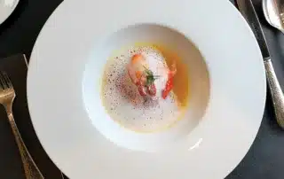 Brittany Blue Lobster in Yellow Curry Broth as served in La Reserve on Oceania Riviera.