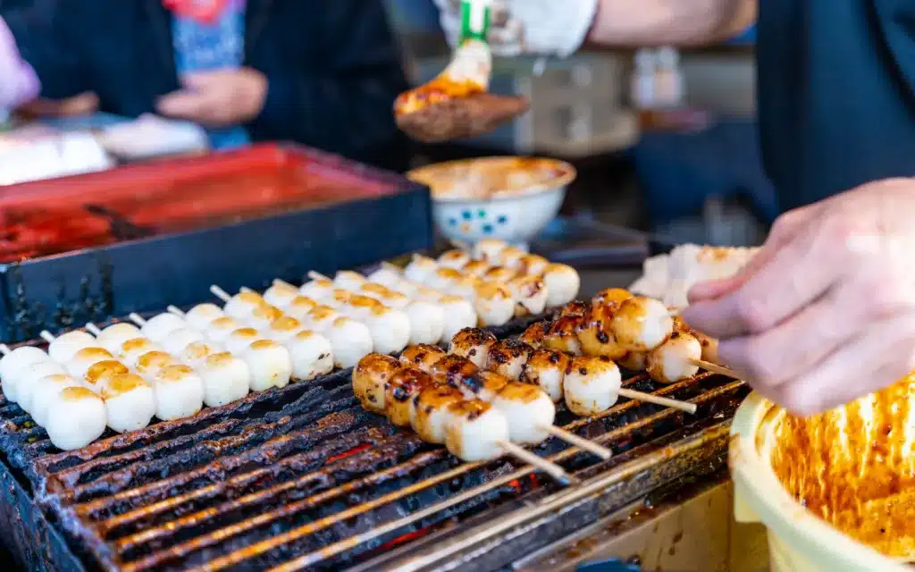 Dango, a Japanese dumpling made with rice flour at food market in Japan.