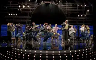 Cast members perform in "Come from Away" on board Cunard's Queen Elizabeth.