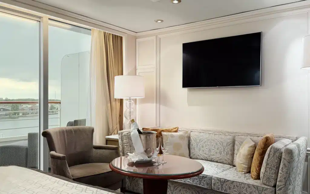 The sitting area in an Aquamarine Suite on Crystal Serenity.