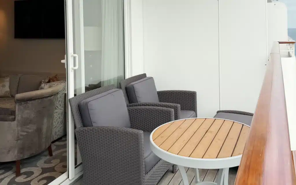 Outdoor furniture adorns the veranda in an Aquamarine Suite.